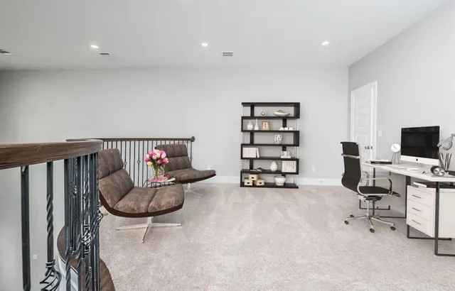 a livingroom with furniture and white walls