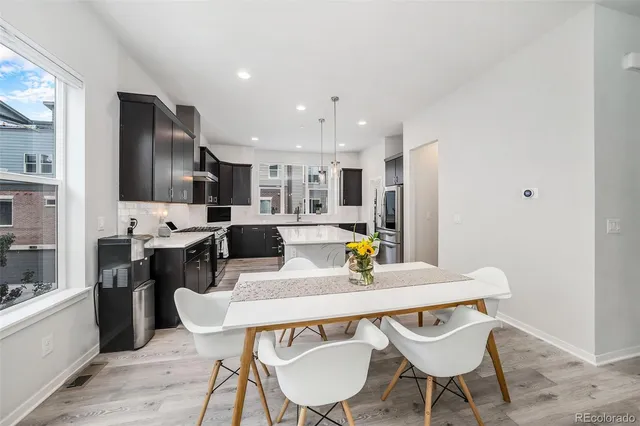 a bedroom with a bed a chair and couch