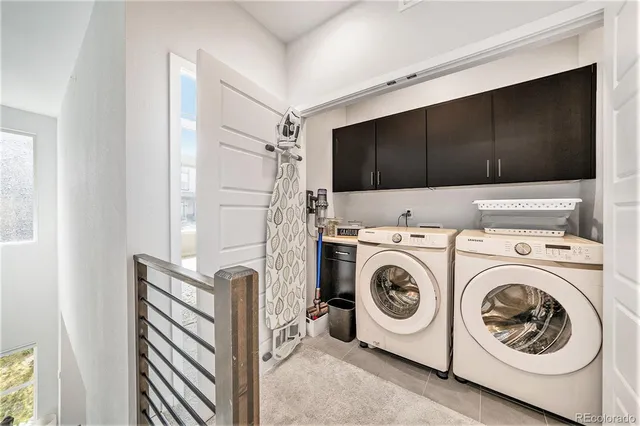 a en suite bathroom with a double vanity sink a mirror and a shower