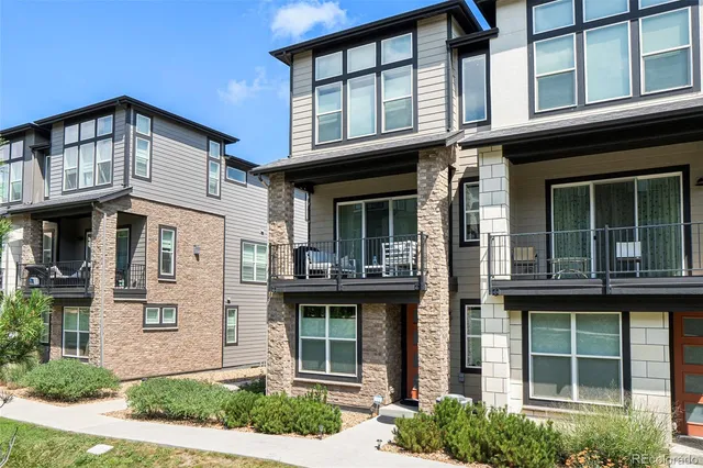 a view of an entryway with wooden floor and door