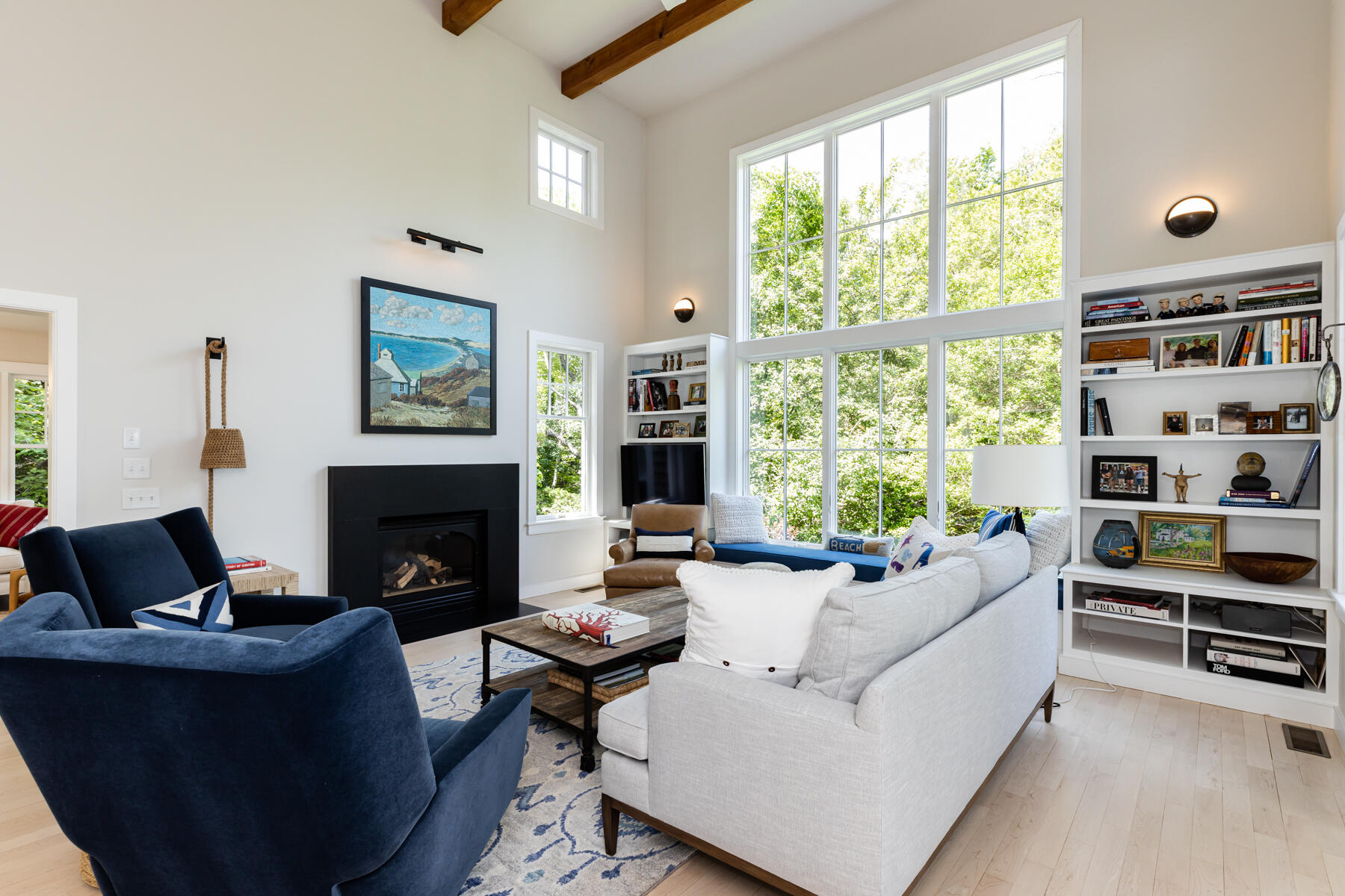 145 Henry's Road Brewster, MA 02631 - Photo 15 of 54 a living room with furniture fireplace and a large window
