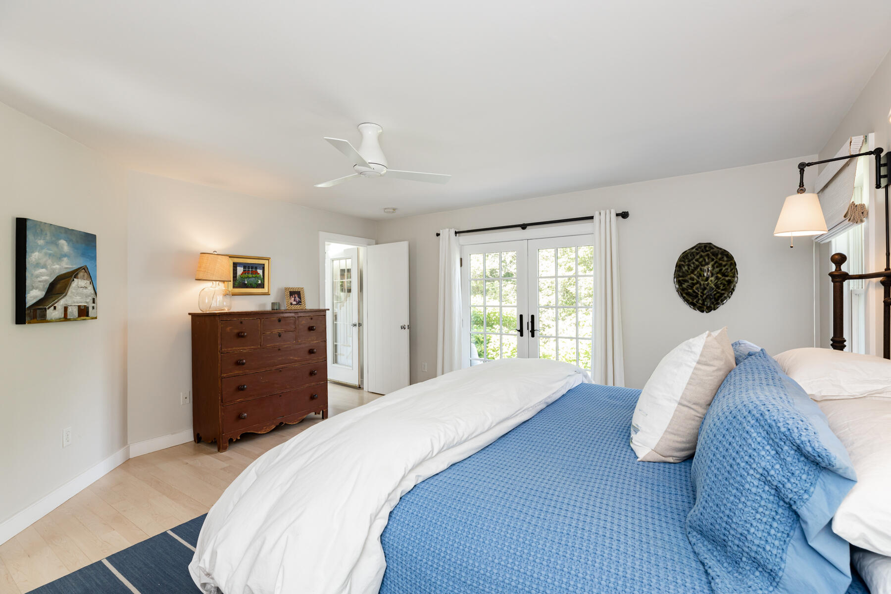 145 Henry's Road Brewster, MA 02631 - Photo 19 of 54 a bedroom with a bed and wooden floor