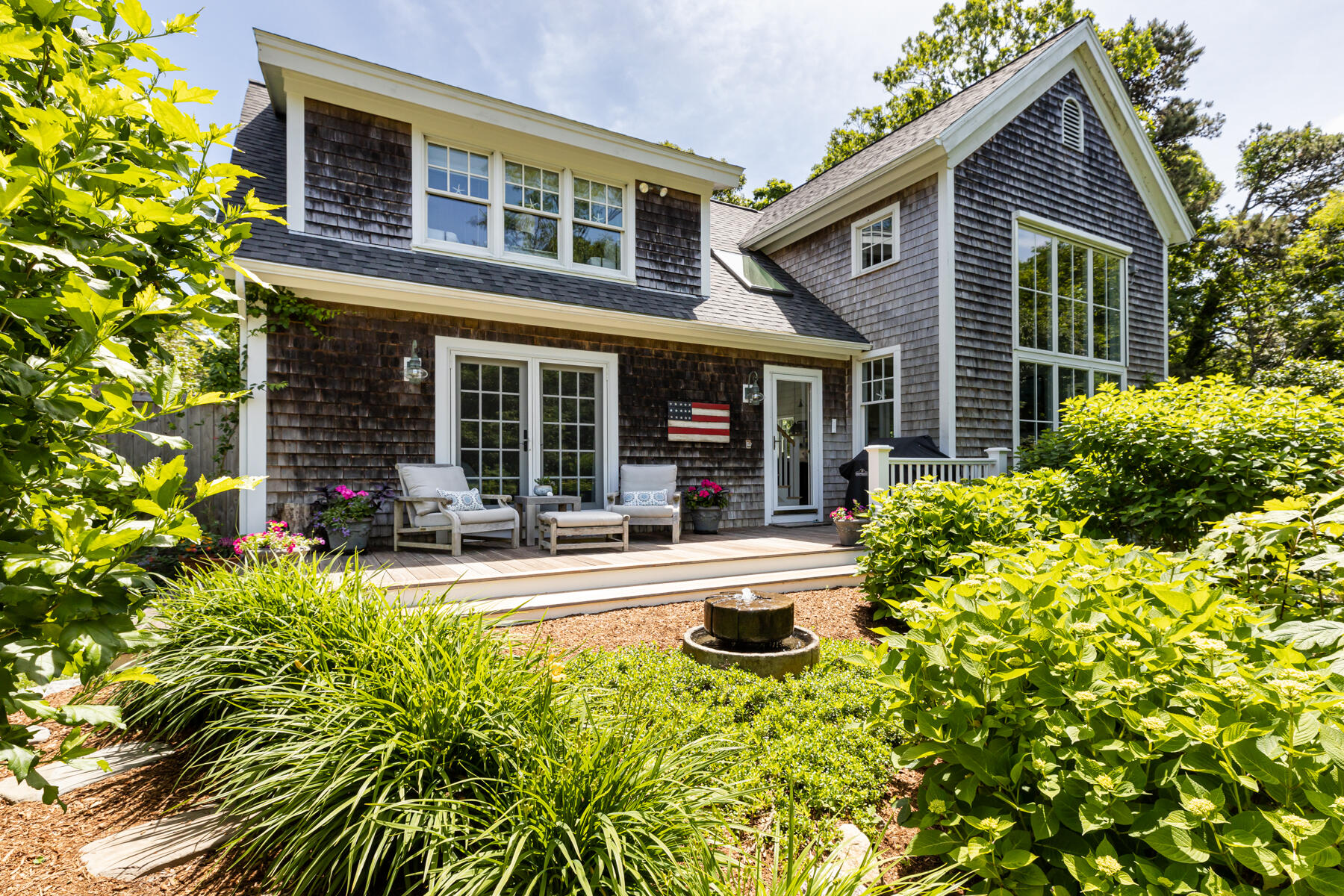 145 Henry's Road Brewster, MA 02631 - Photo 2 of 54 front view of a house with a patio