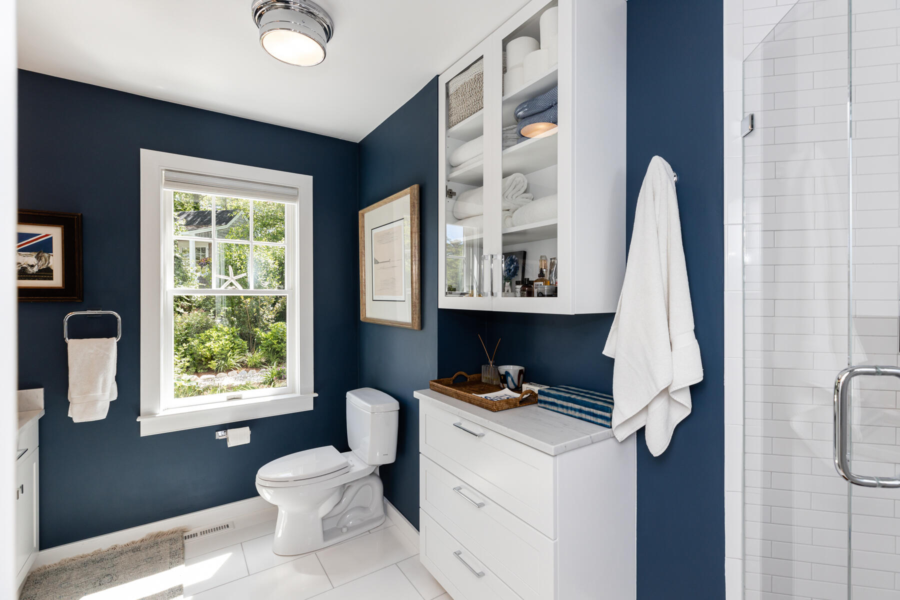 145 Henry's Road Brewster, MA 02631 - Photo 24 of 54 a bathroom with a sink a toilet and a window