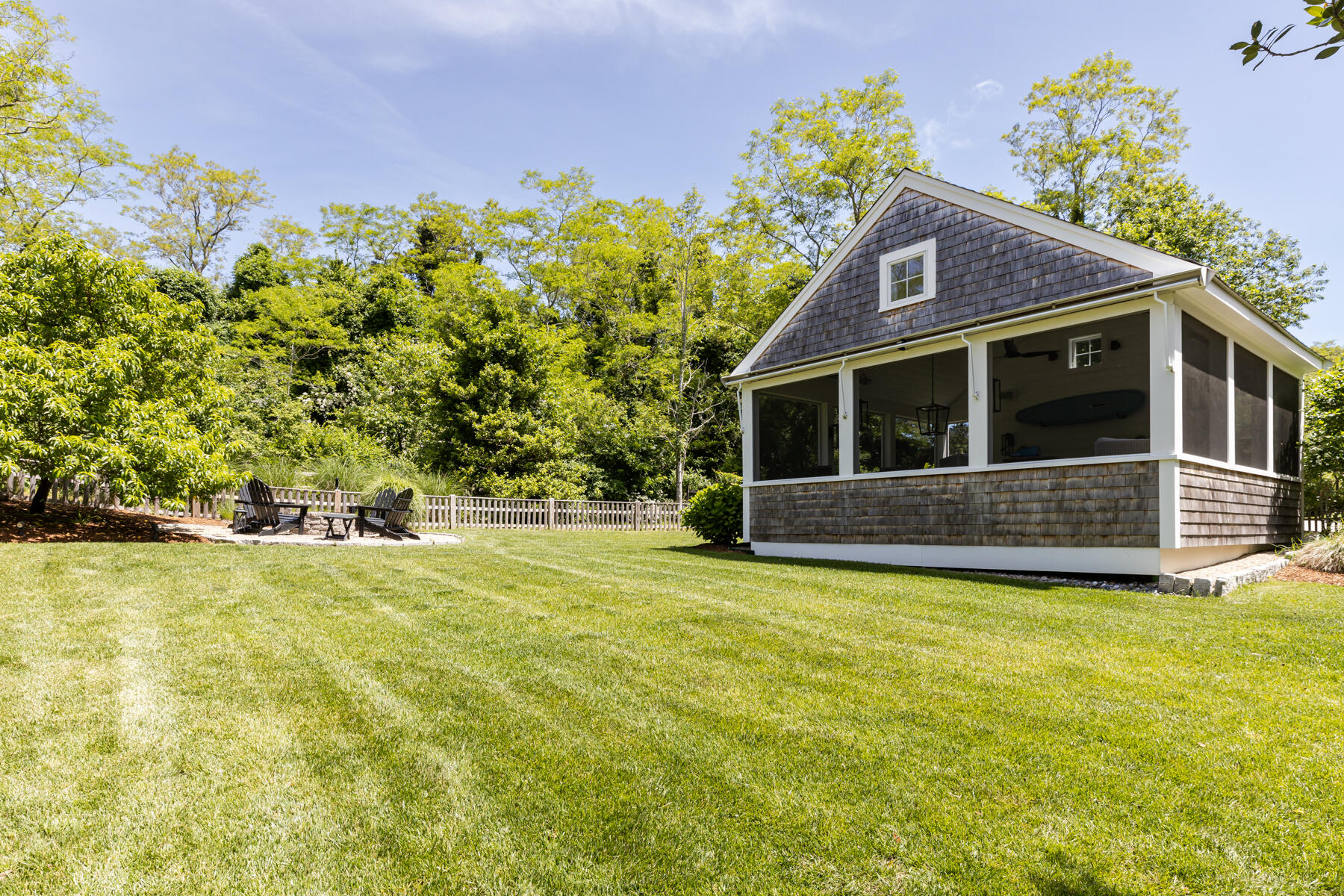 145 Henry's Road Brewster, MA 02631 - Photo 37 of 54 a front view of a house with a yard