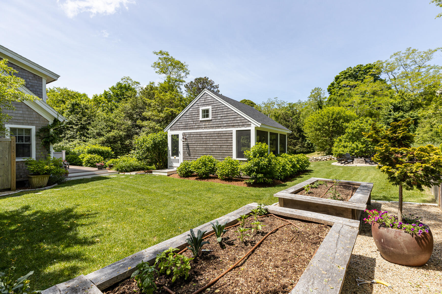 145 Henry's Road Brewster, MA 02631 - Photo 41 of 54 a front view of a house with garden