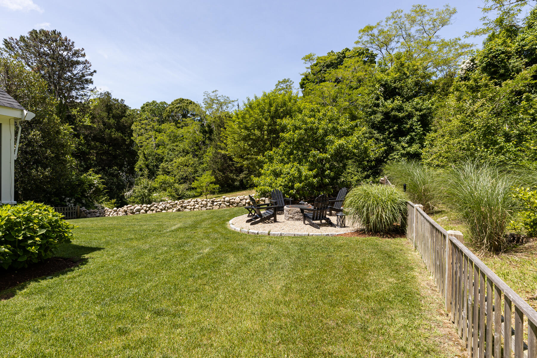 145 Henry's Road Brewster, MA 02631 - Photo 43 of 54 a view of a backyard with plants and a garden
