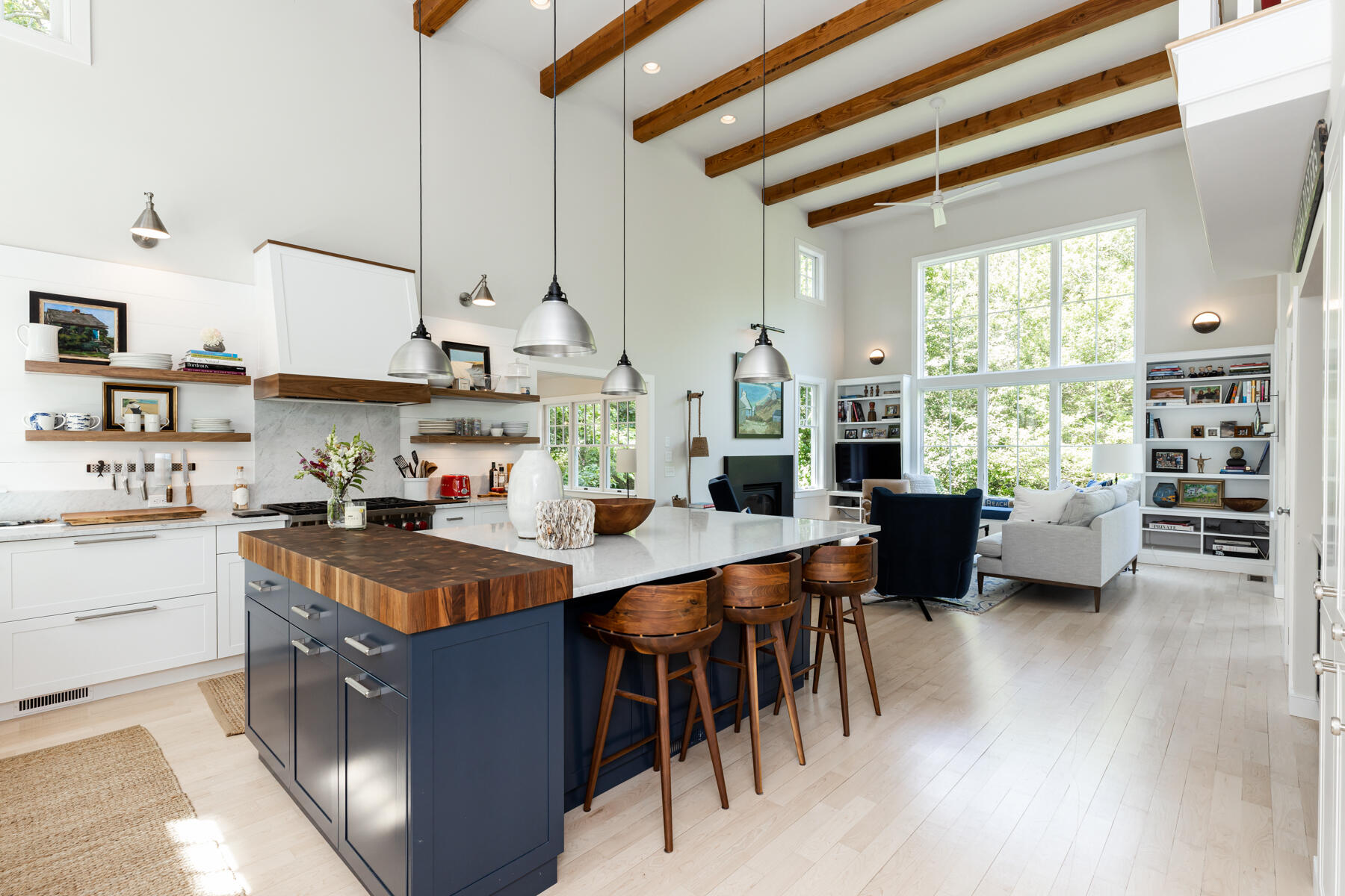 145 Henry's Road Brewster, MA 02631 - Photo 6 of 54 a kitchen with stainless steel appliances granite countertop a stove a sink dishwasher and a dining table with wooden floor