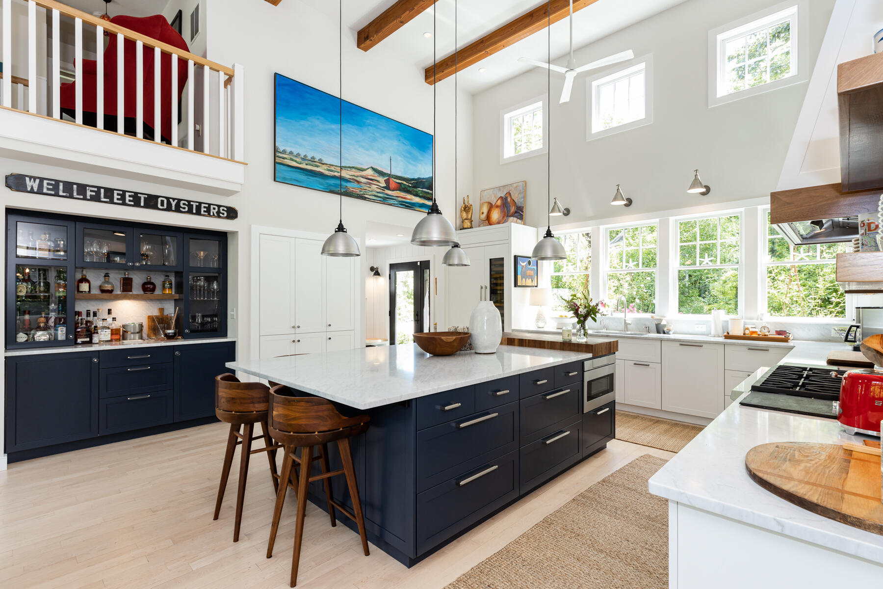 145 Henry's Road Brewster, MA 02631 - Photo 9 of 54 a kitchen with stainless steel appliances granite countertop a sink counter space and living room view
