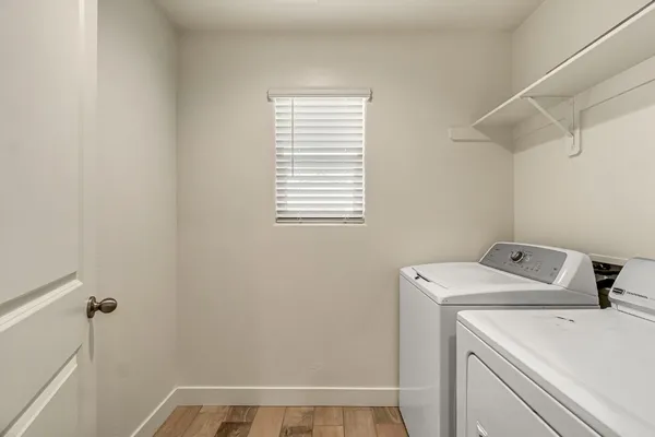 a utility room with dryer and washer