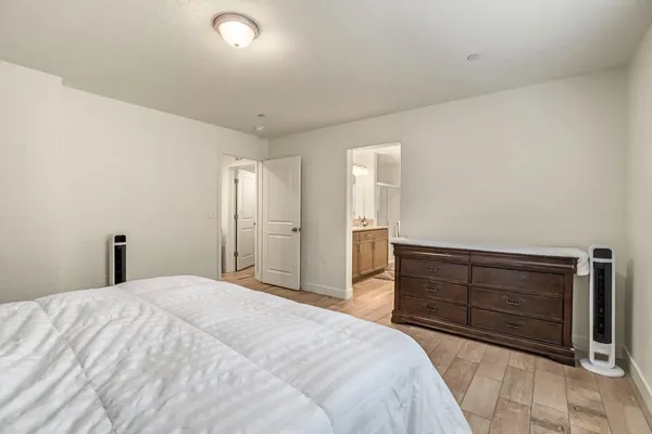 a bedroom with a bed and a dresser