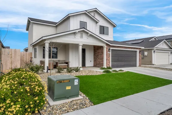 a view of a house with a yard and plants