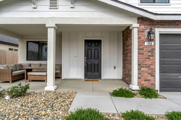 a front view of a house with garden