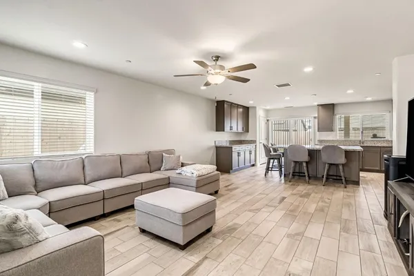 a living room with furniture and a large window