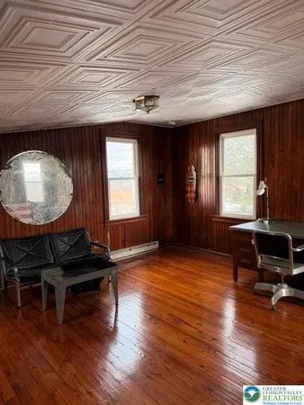 a kitchen with stainless steel appliances a stove a refrigerator and a microwave