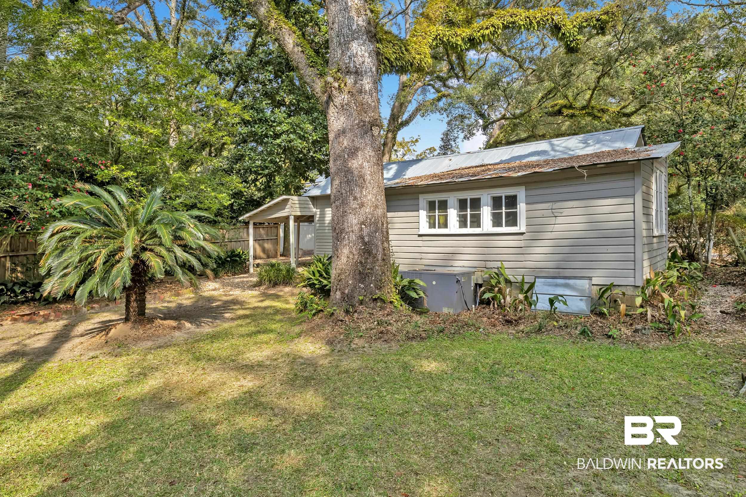 55 Boise Lane Fairhope, AL 36532 - Photo 23 of 24 Exterior space with fence and a lawn