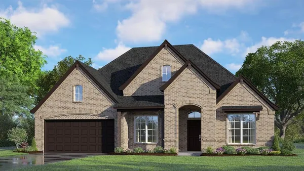 a front view of a house with yard and garage