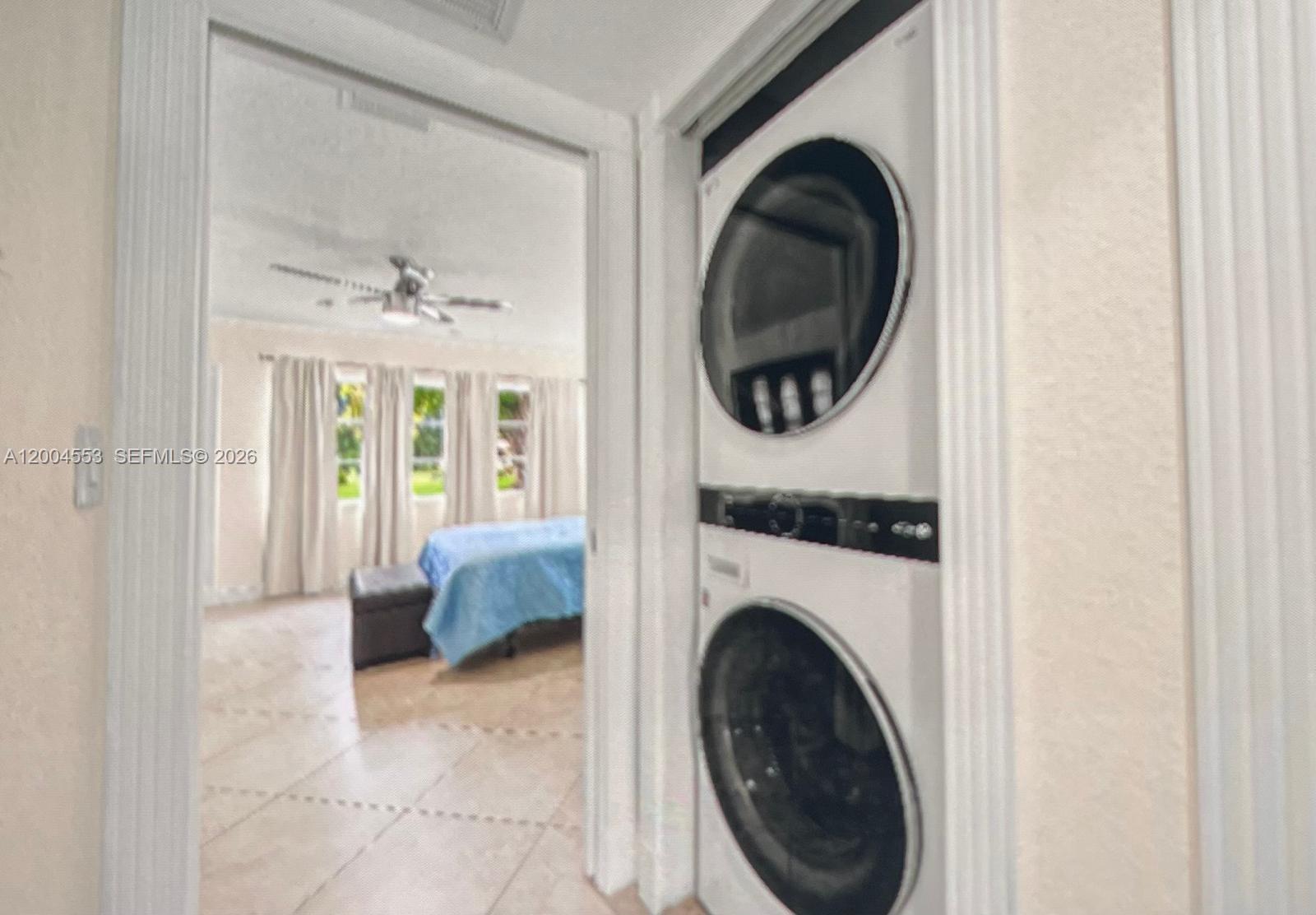 13990 Nesting Way, Unit C Delray Beach, FL 33484 - Photo 18 of 18 a living room with furniture and a fireplace