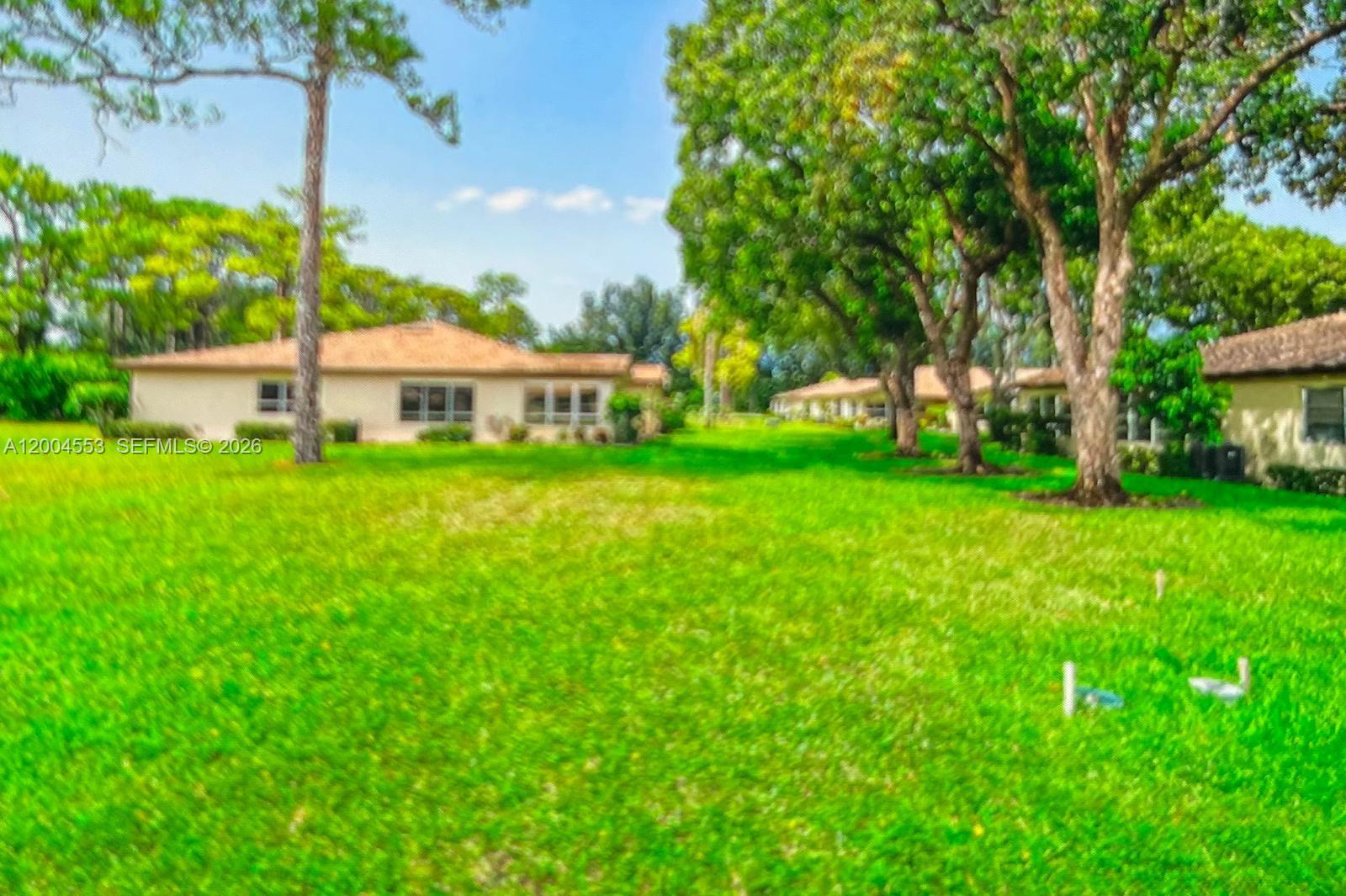13990 Nesting Way, Unit C Delray Beach, FL 33484 - Photo 3 of 18 a view of a house with a big yard