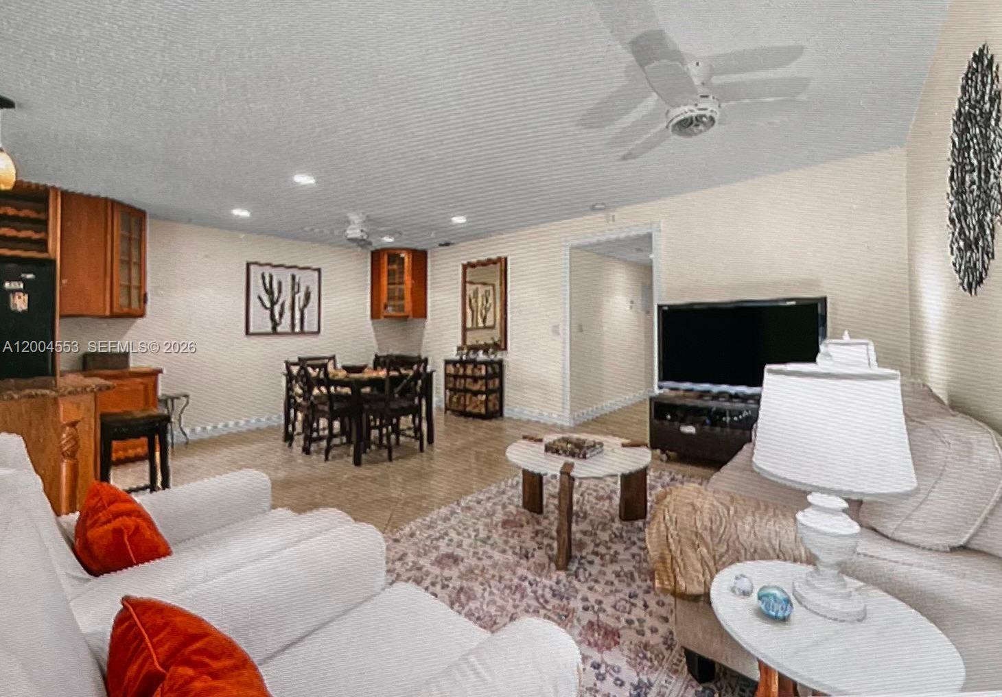 13990 Nesting Way, Unit C Delray Beach, FL 33484 - Photo 6 of 18 a living room with furniture and a flat screen tv