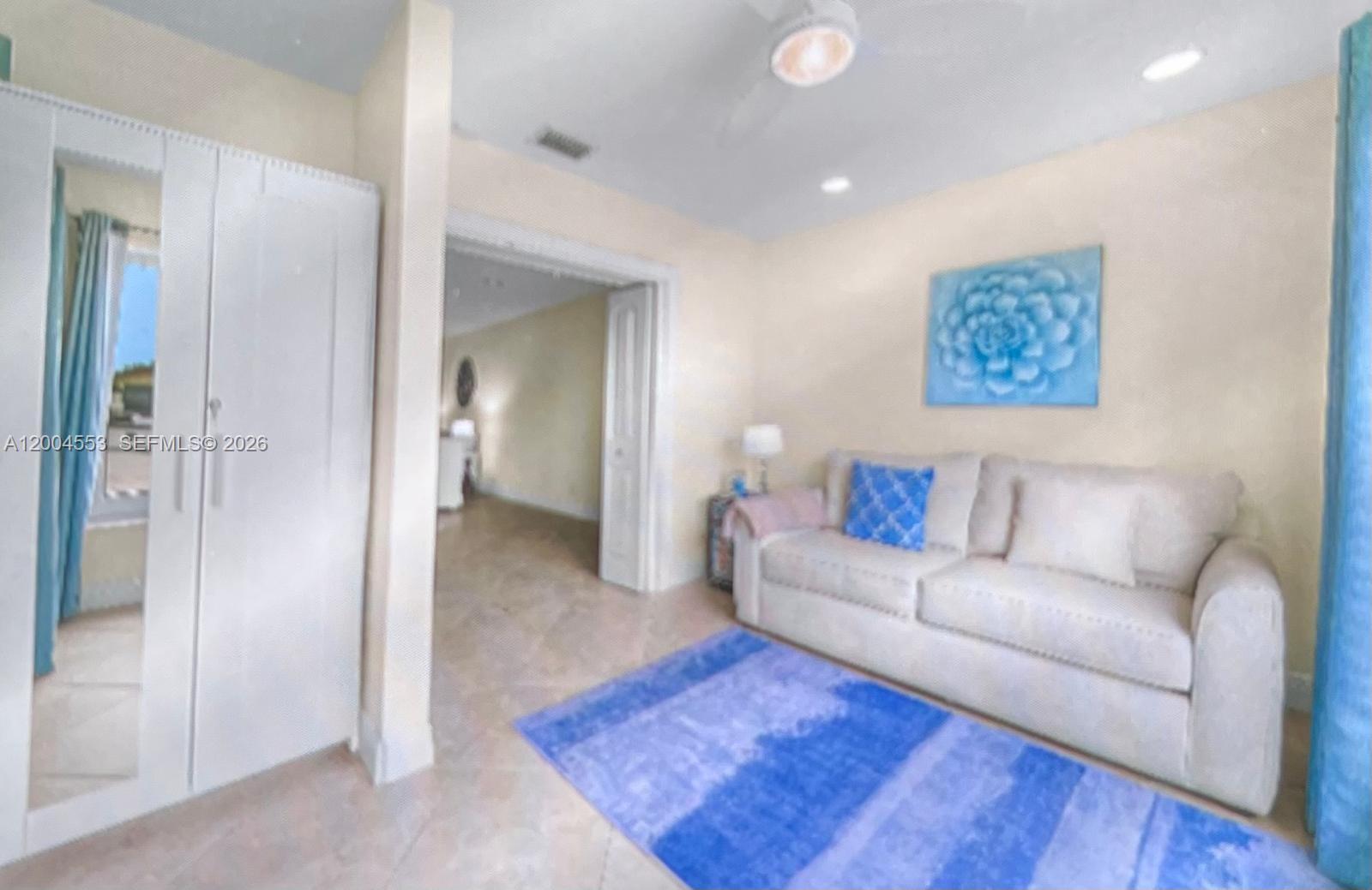 13990 Nesting Way, Unit C Delray Beach, FL 33484 - Photo 7 of 18 a living room with furniture and a rug