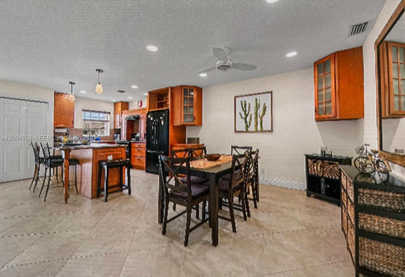 13990 Nesting Way, Unit C Delray Beach, FL 33484 - Photo 10 of 18 a view of a dining area with furniture