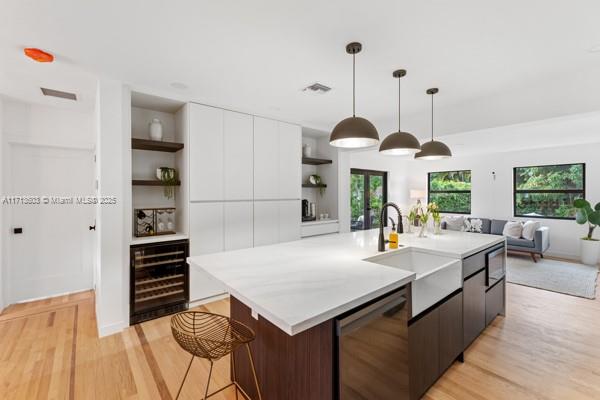 1024 Southwest 23rd Road Miami, FL 33129 - Photo 11 of 33 a view of kitchen island with furniture and wooden floor