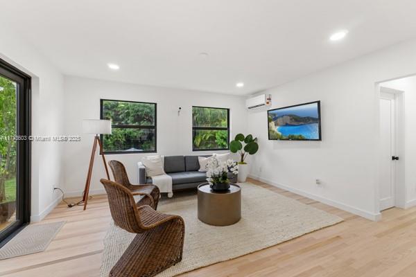 1024 Southwest 23rd Road Miami, FL 33129 - Photo 12 of 33 a living room with furniture potted plant and windows