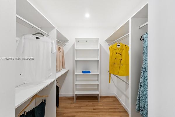 1024 Southwest 23rd Road Miami, FL 33129 - Photo 17 of 33 a hallway with a closet and wooden floor