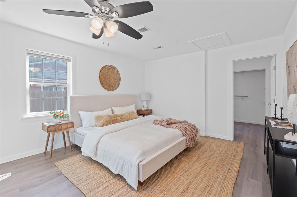 1156 Nickols Avenue Austin, TX 78721 - Photo 13 of 23 a bedroom with a bed and window