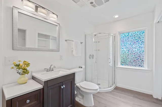 a room with a bed and a sink