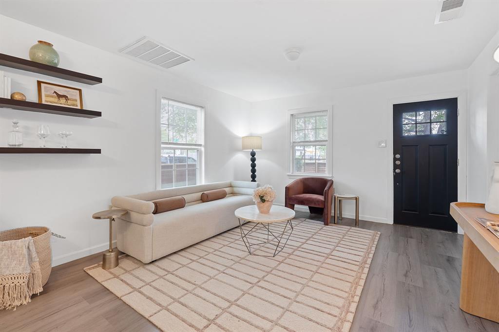 1156 Nickols Avenue Austin, TX 78721 - Photo 8 of 23 a bedroom with furniture and wooden floor