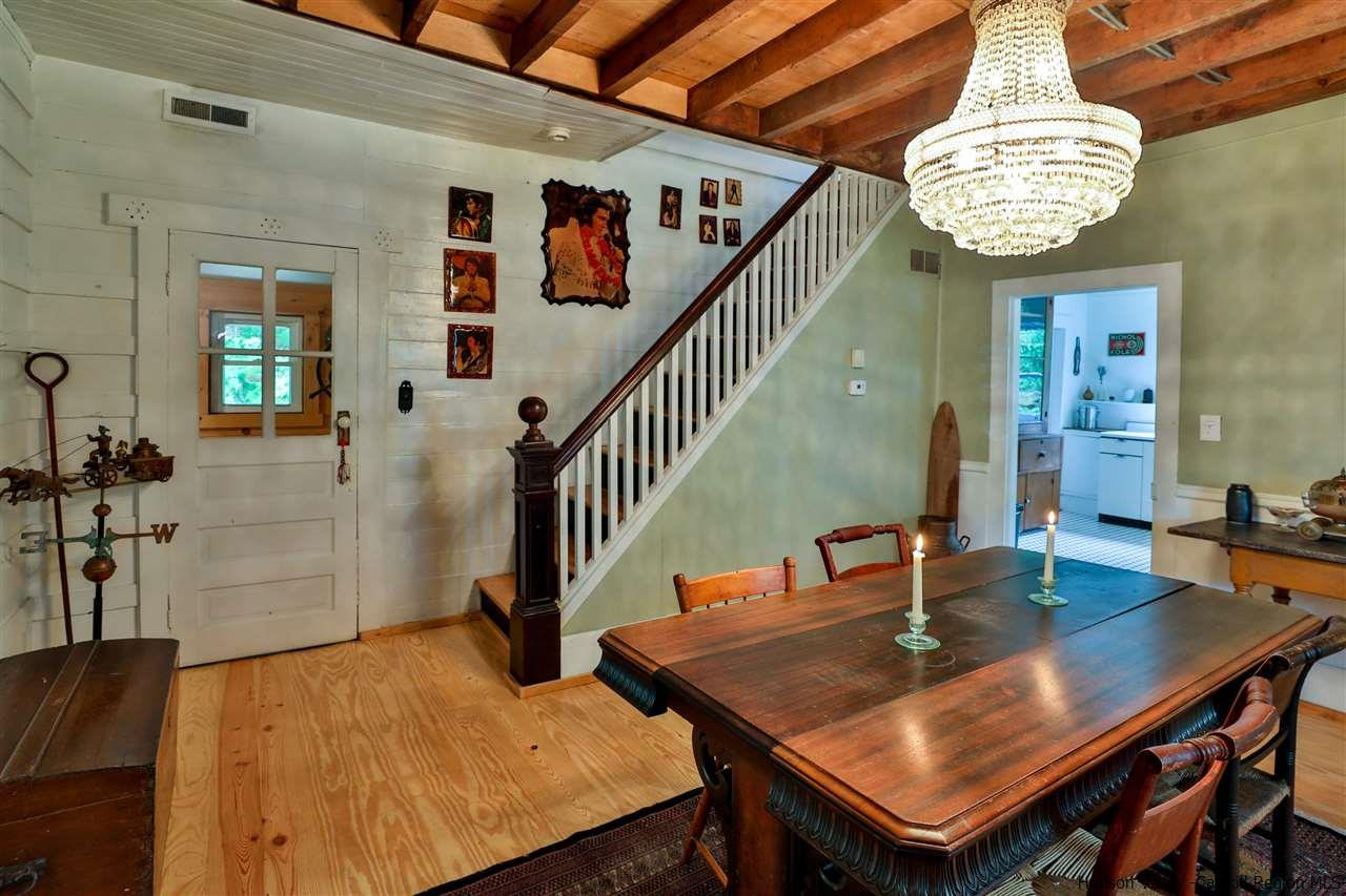 499 County Route 3 Fleischmanns, NY 12430 - Photo 12 of 25 a dining room with furniture a chandelier and wooden floor