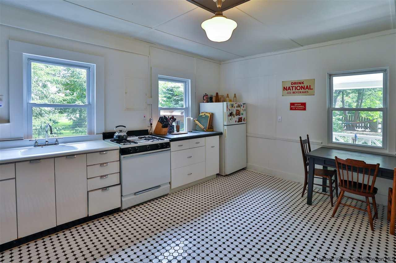 499 County Route 3 Fleischmanns, NY 12430 - Photo 14 of 25 a kitchen with a sink a table and chairs