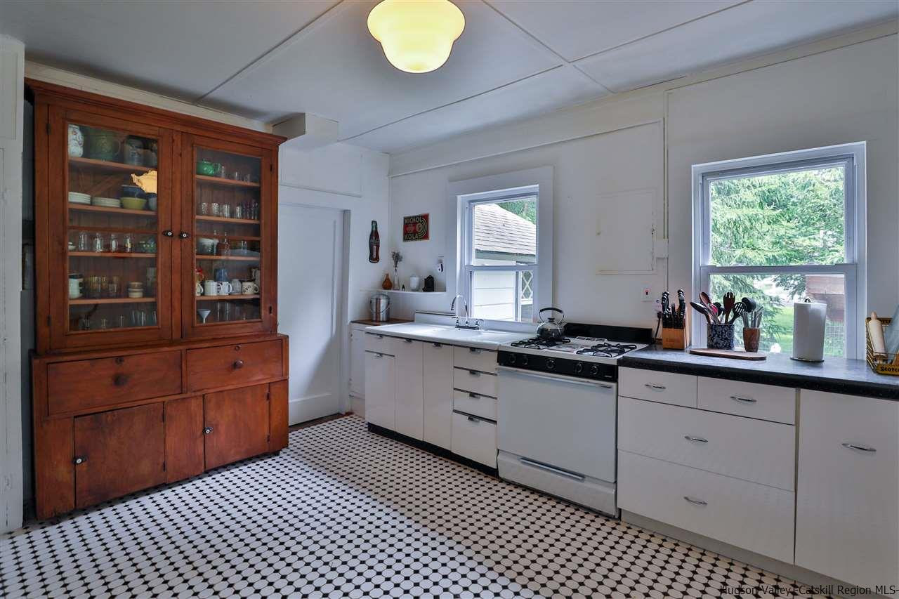 499 County Route 3 Fleischmanns, NY 12430 - Photo 15 of 25 a kitchen with granite countertop cabinets a stove a sink and a window