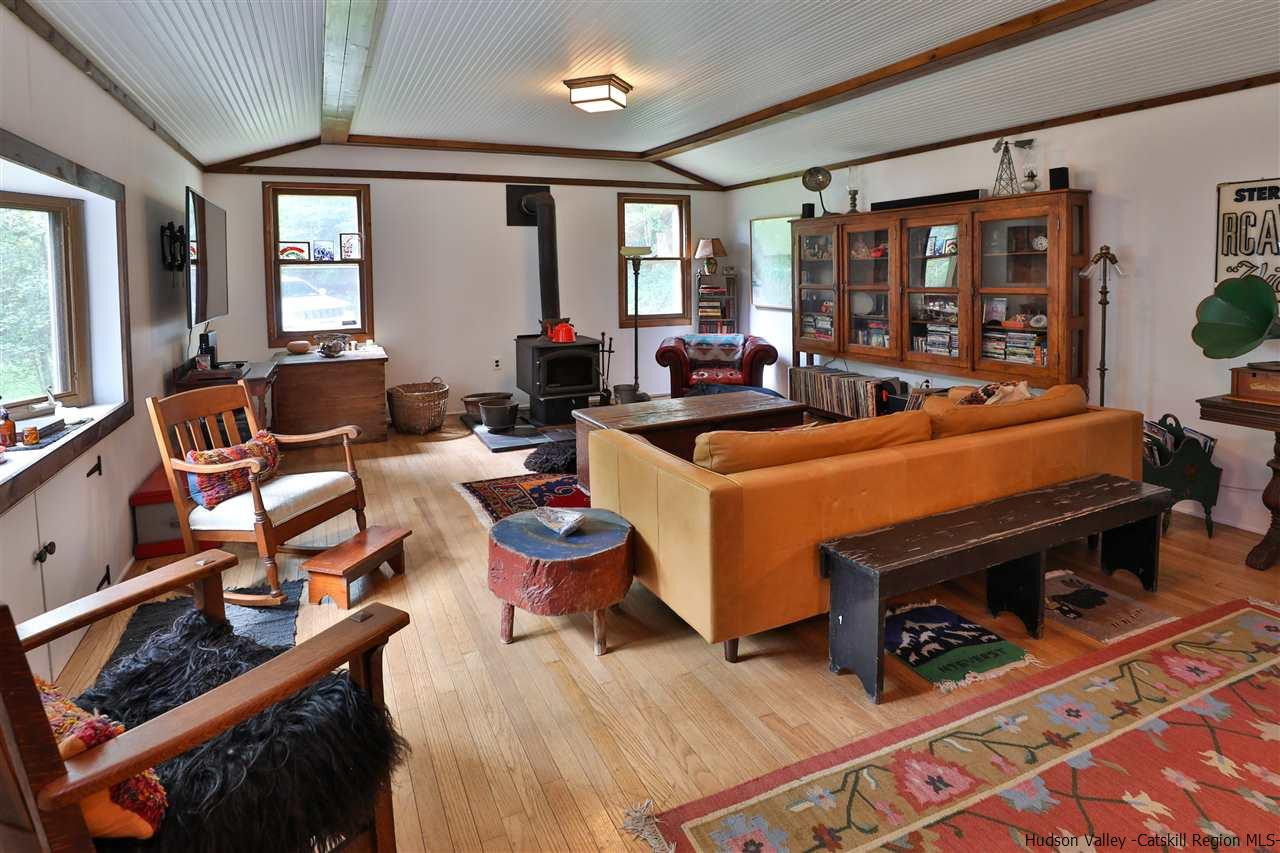 499 County Route 3 Fleischmanns, NY 12430 - Photo 3 of 25 a room with furniture a rug toys and windows