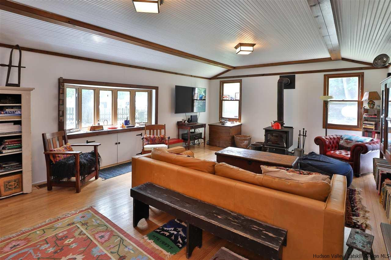 499 County Route 3 Fleischmanns, NY 12430 - Photo 4 of 25 a living room with furniture fireplace and large windows
