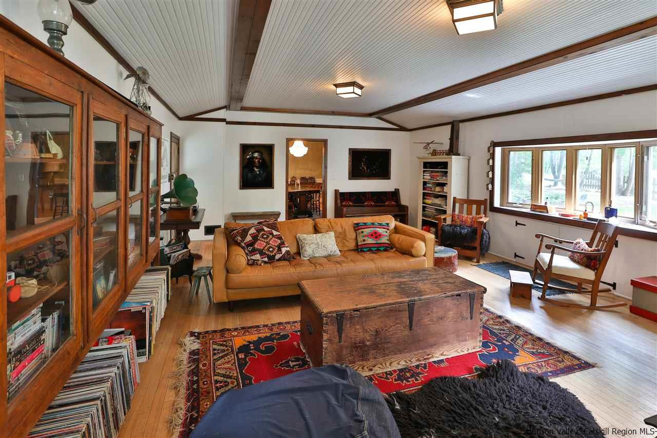 499 County Route 3 Fleischmanns, NY 12430 - Photo 6 of 25 a living room with furniture a flat screen tv and a large window