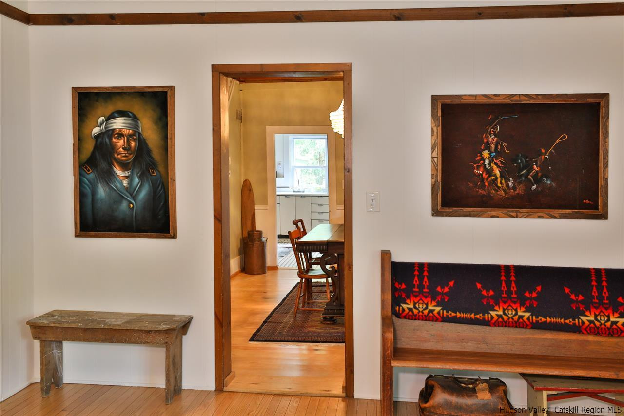 499 County Route 3 Fleischmanns, NY 12430 - Photo 7 of 25 a view of a hallway with wooden floor and a potted plant