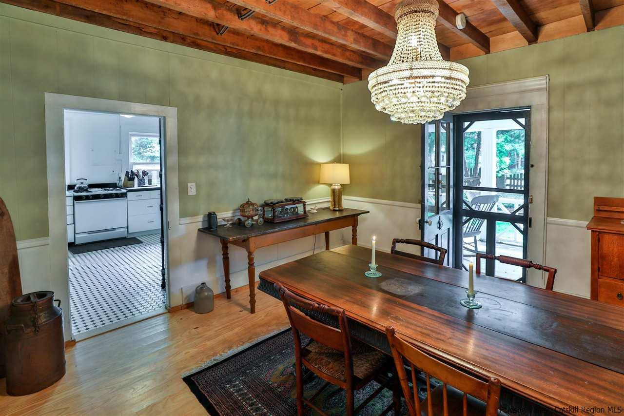 499 County Route 3 Fleischmanns, NY 12430 - Photo 9 of 25 a dining room with furniture a chandelier and wooden floor