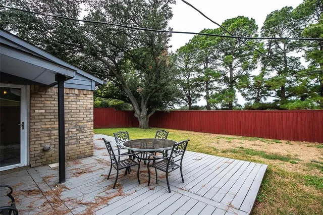 a view of backyard with a patio and wooden floor