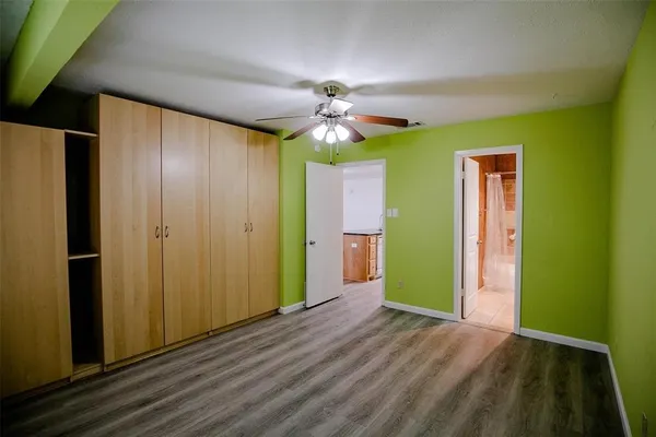 a view of a livingroom with a chandelier fan