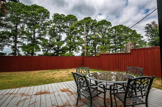 a view of a chairs and table in the patio