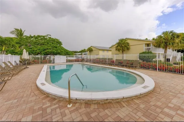 an aerial view of a house with outdoor space and lake view