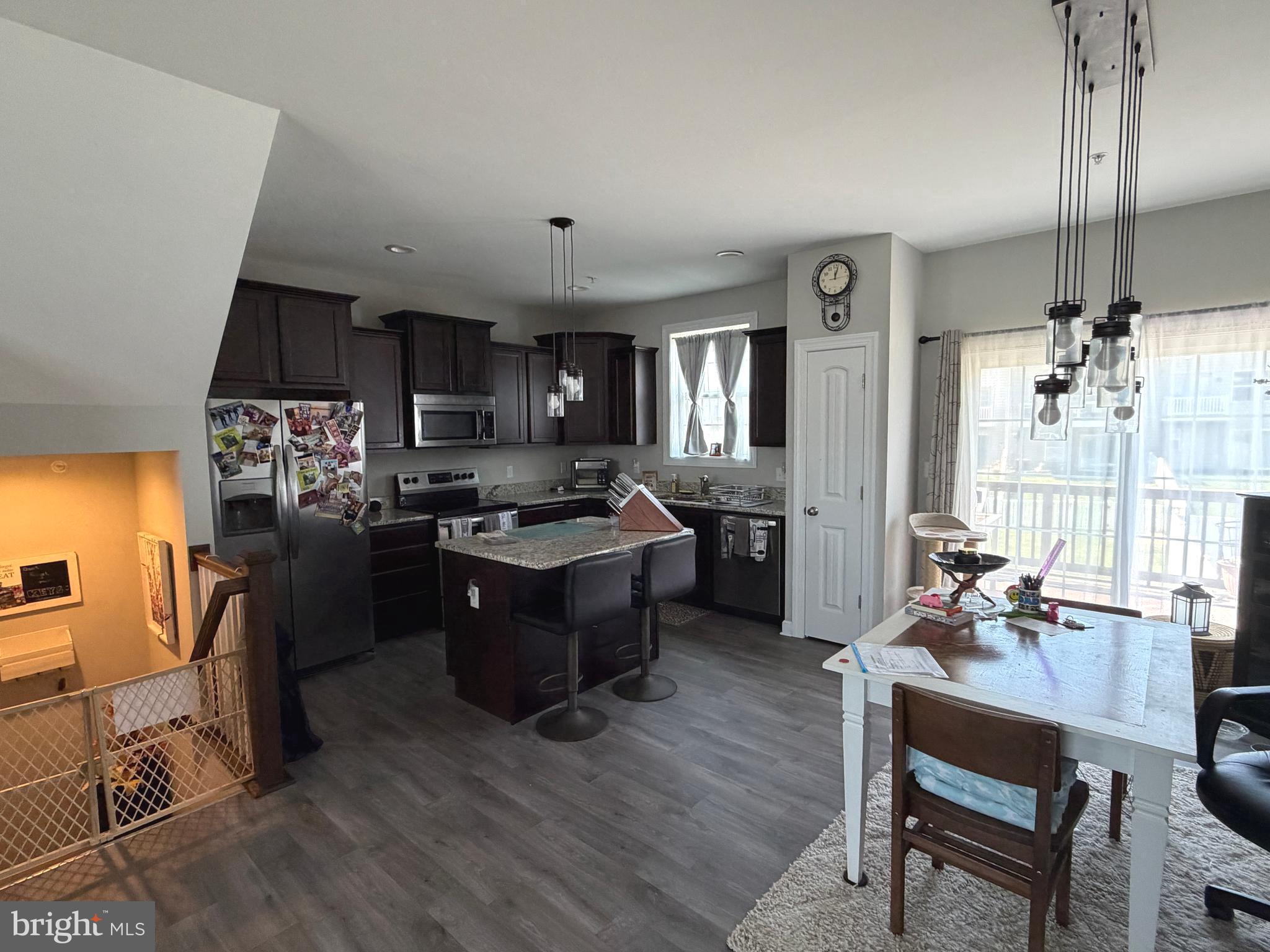 522 Charles Avenue Hanover, PA 17331 - Photo 21 of 59 a kitchen with a refrigerator dining table and chairs