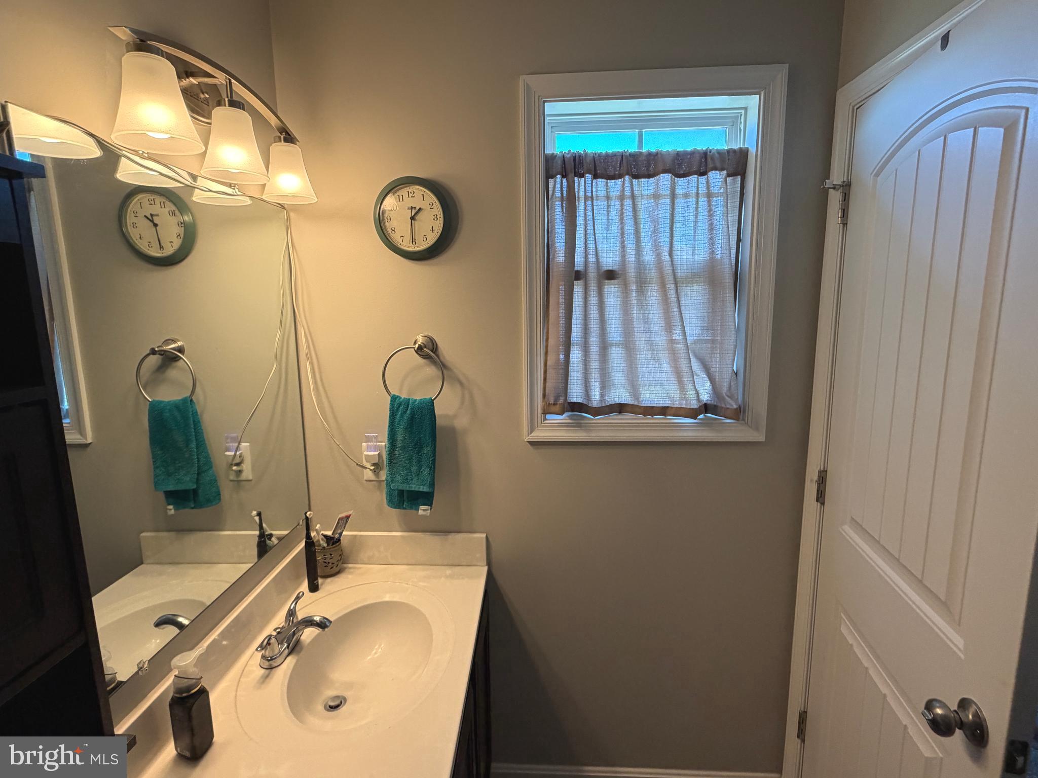 522 Charles Avenue Hanover, PA 17331 - Photo 46 of 59 a bathroom with a sink vanity and a mirror