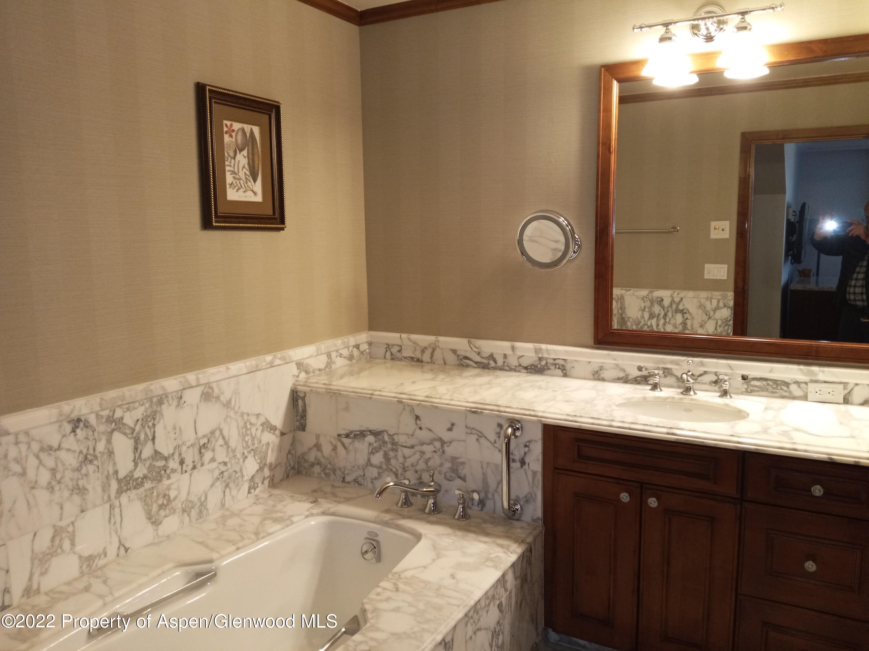 39 Boomerang Road, Unit 8412 SUMMER INTEREST 7 Aspen, CO 81611 - Photo 11 of 21 a bathroom with a bathtub and a sink