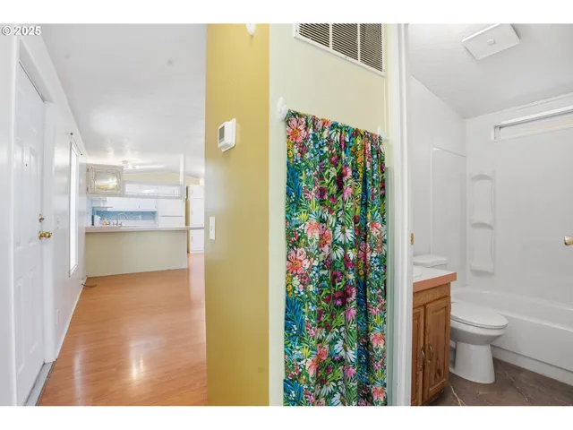 a bathroom with a sink a toilet and bathtub