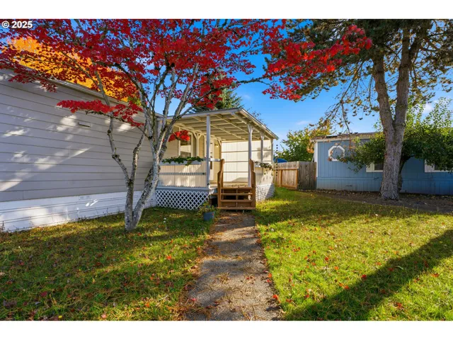 a swimming pool with trees in the background