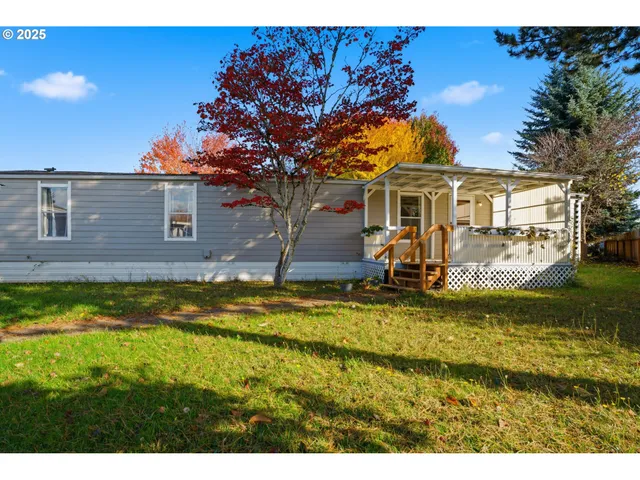 a view of a backyard with a patio